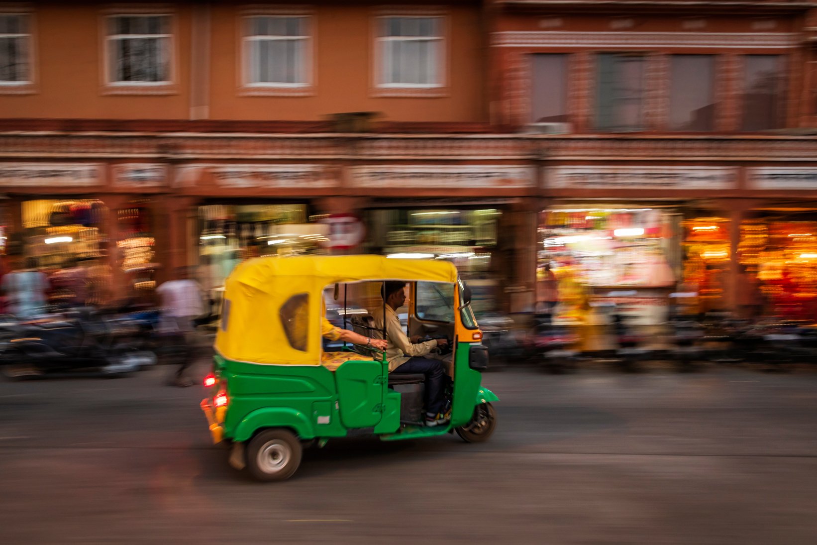 Indian man drives auto rickshaw (tuk-tuk), India