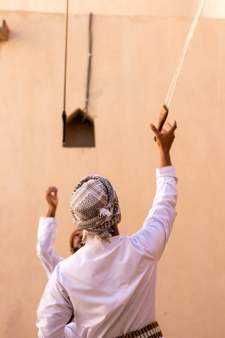 MASCATE, OMAN - DECEMBER, 07, 2021: traditional Arabic sword dance in Muscat, capital of Oman